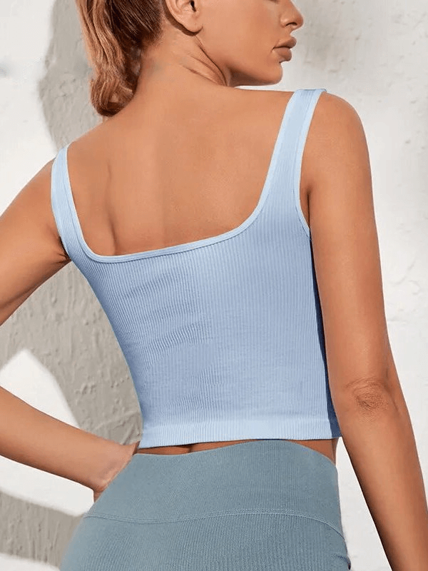 Woman wearing light blue breathable seamless sports top, showcasing back view with comfortable fit and pushup effect.